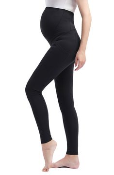 Equipped a supportive panel that expands with your growing bump, these superstretchy leggings will keep you looking cool and feeling comfortable. 28" inseam; 9" leg opening; 15 1/2" front rise; 18" back rise (size Medium) 88% nylon, 12% spandex Machine wash, line dry Imported High Stretch Maternity Yoga Bottoms, Stretch Workout Leggings For Maternity, Workout Stretch Leggings For Pregnancy, Fitted Bump Friendly Leggings For Gym, Fitted Bump Friendly Leggings, Bump Friendly Fitted Leggings, Bump Friendly Black Leggings For Pilates, Black Bump Friendly Leggings For Pilates, Compression Black Bottoms For Barre