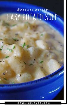 a blue bowl filled with potato soup on top of a table