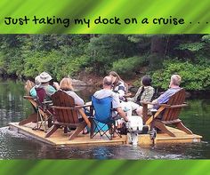 a group of people sitting on top of a wooden dock