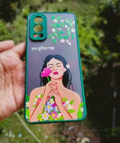 a person holding up a phone case with an image of a woman and flowers on it