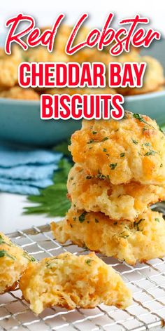 red lobster cheddar bay biscuits stacked on top of each other in front of a bowl