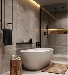 a large white bath tub sitting inside of a bathroom