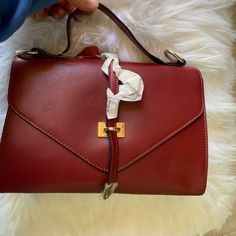 Burgundy Flat Leather: Top Leather Handle Bag With Gold Tone Hardware, Detachable Leather Shoulder Strap. Dual Interior Pocket, Single Zip Pocket At Center, Magnetic Closure At Front Flap, Protective Feet At Base. Height:8”Width:11”Depth:4”Handle Drop:10” Shoulder Strap:28” Pink Michael Kors Bag, Gucci Gg Bag, Purple Purse, Kate Spade Shoulder Bag, Studded Bag, Burgundy Top, Genuine Leather Purse, Black Shoulder Bag, Mini Shoulder Bag