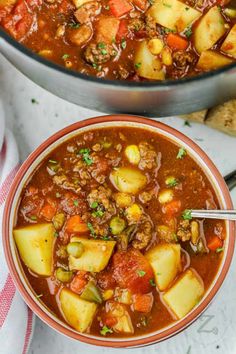 two bowls filled with stew next to each other