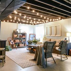 a living room filled with furniture and lots of lights