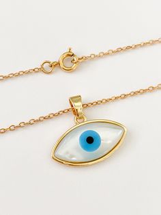 Evil eye necklace/charm Dainty mother of pearl and 18k gold plated eye charm. It will help you to stay away or protected from negative energies, bad vibes, envy, evil eye. Ideal for gifts. It's available only the charm or with the chain. MATERIAL AND SIZE 18k Gold plated Evil eye Mother of pearl 18k Gold filled chain Length: You can choose it If you have questions about the product, feel free to reach me out. Don't forget to check out my other items in the store: Https://www.etsy.com/shop/nyahwi Gold Plated Evil Eye Amulet Jewelry, Gold Plated Evil Eye Jewelry Gift, Gold Plated Evil Eye Jewelry As Gift, Gold-plated Evil Eye Jewelry As Gift, White Evil Eye Jewelry, Evil Eye Jewelry Gift, Gold Plated Evil Eye Pendant Charm Necklace, Gold Plated Evil Eye Charm Necklace Gift, Protection Amulet