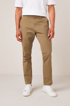 A wardrobe staple, our versatile chino trousers are made from a cotton stretch fabric for comfort and style all in one. Designed in a classic chino silhouette, they look great dressed up or down. With two functional back pockets, our variety of fits, colours, and leg lengths ensure you can find your perfect match. Also available with a modern update, our elasticated waist styles offer an adjustable fit that's right for you, and our pleat chinos offer a choice in an everyday classic. Next - Your Stretch Cotton Fabric, Wardrobe Classic, Printed Trousers, Slim Fit Trousers