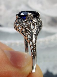 Excited to share the latest addition to my #etsy shop: 2ct Round Cut Sim Blue Sapphire Gemstone Sterling Silver Art Nouveau Floral Leaf Filigree Ring (Made To Order) {Design#198} https://etsy.me/3dMbvpq #blue #round #floral #yes #no #silver #women #artnouveau #antiqued Elegant Sapphire Jewelry With Intricate Design, Exquisite Filigree Ring For Formal Occasions, Silver Filigree Ring With Prong Setting, Victorian Sapphire Jewelry With Filigree, Anniversary Sapphire Filigree Jewelry, Classic Filigree Ring With Intricate Design For Formal Events, Classic Filigree Ring With Intricate Design For Formal Occasions, Ornate Sterling Silver Filigree Ring With Intricate Design, Elegant Filigree Ring With Intricate Design For Formal Events