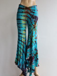 "Handmade Materials: Cotton, Lycra Description These tie dye splatter bell bottoms are made for movement! Perfect for yoga and flow activities. Handmade and hand-dyed, available from a variety of 4 colour ways to choose from 🌸 The fitting around the thigh is flattering & shaping until the material billows out at the knee into a wide flare. Featuring drawstrings on either side of the thigh that can be cinched for shape and length adjustment! The material consists of a quality Rayon 95% spandex 5 Flow Activities, Purple Bell Bottoms, Black Bell Bottoms, Hippy Festival, Colour Ways, Cute Leggings, Flared Trousers, Festival Clothing, Hippie Festival