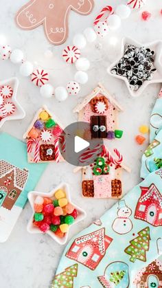 christmas cookies and candies on a table with candy in the shape of gingerbread houses