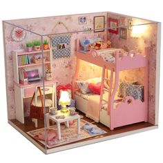 a doll house with furniture and accessories in the room, including a bunk bed for two