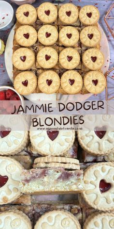 jammie dodger blondies are arranged on a table with other pastries and desserts