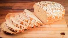 sliced loaf of bread sitting on top of a cutting board