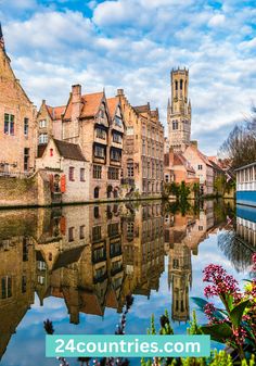 an old european town is reflected in the water