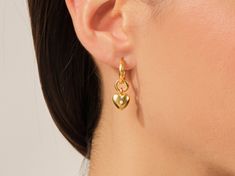 The earrings feature a delicate heart-shaped design, meticulously fashioned from lustrous 14k gold, adding a touch of opulence to any ensemble. The warm, radiant glow of the gold complements various styles, making these earrings a versatile accessory for both casual and formal occasions. FEATURES• Made to Order• Gold Kt: 14k Solid Gold, 18k Solid Gold• Gold Color: Rose Gold, Yellow Gold, White Gold• Width x Height: 2.50 mm x 30.00 mm• Inner Diameter: 11.00 mm• Gemstone: Diamond• Diamond Cut: Rou Valentine's Day Polished Finish Earrings, Elegant Heart Charm Huggie Earrings, Elegant Heart Huggie Earrings For Pierced Ears, 14k Gold Tarnish Resistant Heart Earrings, Single Gold Plated Heart Earring For Anniversary, Classic Gold Double Heart Earrings, Gold Plated Single Heart Earring For Anniversary, Gold Open Heart Earrings For Pierced Ears, Elegant Heart Earrings With Polished Finish