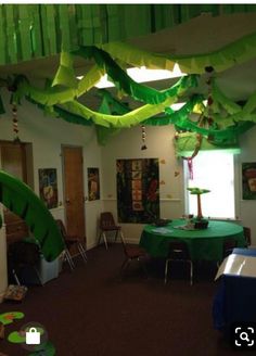 the room is decorated with green paper decorations