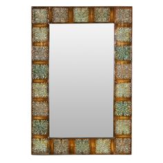 a mirror that is sitting on top of a white surface with gold and green designs