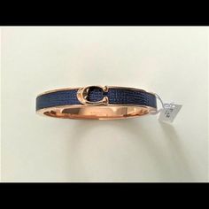 Brand New Coach Signature Push Hinged Bangle Bracelet *Sold Out Color* 100% Authentic Coach Rose Gold Signature "C" On Midnight Navy Blue Leather Midnight Navy Blue / Rose Gold Rose Gold Plated Brass Push Magnetic Hinged Closure Perfect For An Casual Day Out Or A Special Event Style F76634 Msrp $98 Chic Blue Jewelry For Formal Occasions, Luxury Adjustable Bracelet By Coach, Luxury Adjustable Coach Bracelets, Luxury Adjustable Coach Bracelet, Formal Adjustable Coach Bracelets, Trendy Blue Formal Jewelry, Elegant Adjustable Coach Bracelets, Chic Coach Bangle Bracelet, Chic Coach Bracelet Jewelry