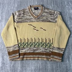 Vintage 80s Career Club Nature Artwork Eagle Hunting Season Casual Preppy Style Multi Color Knit Sweater Medium Mens Condition: Fair Used Condition = Has stains on the front part of the sweater due to wear and age. Measurements: Please see photos above for all measurements IF YOU BUY TWO OR MORE ITEMS USE THE CODE BUNDLE @ CHECK TO SAVE 20% WE SHIP WITHIN 24 HOURS AFTER PURCHASE! Please be aware that we do not offer free returns!! The Buyer is responsible for the cost of the return label.  Follow us on TikTok & Instagram @findsnostalgic and tag us in your finds Knit Patchwork V-neck Sweater, Retro Knitted Sweater For Fall, Retro Knitted Tops For Fall, Retro Crew Neck Cardigan For Fall, Retro Patchwork Sweater For Spring, Multicolor Retro V-neck Sweater, Retro Multicolor V-neck Sweater, Casual Knit Patterns For Fall, Casual Fall Knit Patterns