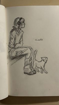 an open book with a drawing of a person sitting on a bench next to a cat