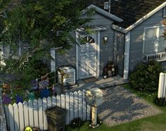 an aerial view of a house with a white picket fence