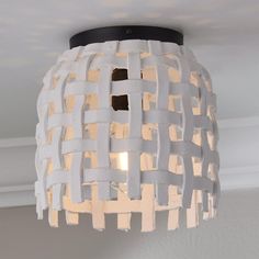 a light fixture made out of strips of paper