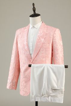 a pink jacket and white pants are on display