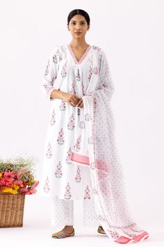 Ivory A-Line kurta with all over purple floral block print, crochet lace work details and V neck. Paired with pant with polka dot print and mulmul dupatta with crochet lace border.
Components: 3
Pattern: Printed and Embellished
Type Of Work: Floral, Polka Dot Block Print and Crochet Lace Work
Neckline: V Neck
Sleeve Type: Three Quarter Sleeves
Fabric: Cotton Cambric, Dupatta: Mulmul
Color: Ivory
Other Details: 
Cut work hem
Front gathered details
Printed dupatta
Side slits
Occasion: Puja,Work - White Bandhani Print Anarkali Set, White Anarkali Set With Bandhani Print, White Cotton Kurta With Printed Border, White Straight Kurta Sets With Printed Border, White Anarkali Kurta With Bandhani Print, Anarkali White Kurta With Bandhani Print, White Sets With Printed Border And Straight Kurta, White Block Print Straight Kurta Lawn Suit, White Block Print Lawn Suit With Straight Kurta