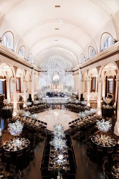 a large banquet hall with tables and chairs set up for a formal function in the center