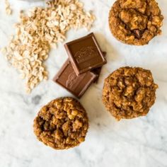 three cookies, one with chocolate and the other oatmeal next to it