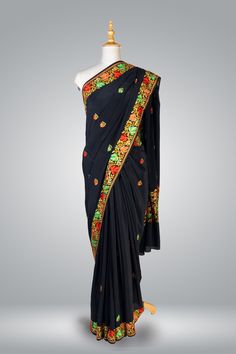 Formal Kashmiri Saree In Black, Pure Crepe Saree Regal Chinar, Hand Aari Embroidered Saree Immerse yourself in the rich heritage of Kashmiri craftsmanship with this exquisite Chinar Pure Crepe Saree adorned with intricate hand aari embroidery. The luxurious black crepe fabric serves as a canvas for the exceptional artistry of the skilled artisans of Kashmir, who dedicate countless hours to create the breathtakingly beautiful motifs adorning this saree. The centerpiece of this saree is the heavy Embroidered Paithani Silk Choli In Traditional Drape, Embroidered Paithani Silk Choli With Traditional Drape, Traditional Embroidered Paithani Silk Choli, Black Embroidered Pre-draped Saree For Navratri, Traditional Black Pre-draped Saree, Festive Black Embroidered Pre-draped Saree, Pre-draped Saree With Embroidered Border For Diwali Ceremonies, Bollywood Embroidered Paithani Silk Saree, Ceremonial Resham Embroidered Saree