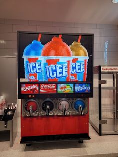 an ice cream vending machine with two scoops of ice cream on top and three different flavored drinks behind it