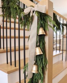 christmas garland with bells hanging from the banister