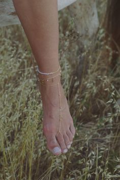 Not sure if you want a pearl anklet or chain anklet? Our Dahlia Anklet is perfect for you. Handcrafted in 14K gold-filled, Our Dahlia Anklet features a half freshwater pearl half cuban link chain anklet that is perfect to wear all year round. Style alone or stack with any of our anklets or foot chains.  14K gold-filled jewelry is water resistant and hypoallergenic Each gemstone is one of a kind, please note the possibility of natural inclusions Handmade with love in Los Angeles 14K Gold-Filled Elegant Gold Pearl Bracelet For Summer, Adjustable Gold Pearl Bracelet For Summer, Delicate Gold Chain Bracelet For Summer, Gold Bracelet With Delicate Chain For Summer, Gold Delicate Chain Bracelet For Summer, Gold Anklets With Pearl Charm As Gift, Gold Anklets With Pearl Charm For Gift, Delicate Gold Bracelets For Summer, Gold Jewelry With Tiny Beads For Summer