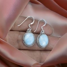 Genuine Larimar Earring, 925 Sterling Silver, Blue Larimar Semi-Precious Gemstones Handmade Earring, Bezel Minimalist Jewelry, Gift for Her. Note:- All kinds of stone are available, Please leave a message or a note. Main Stone: Larimar  Metal Purity: 925 Sterling Silver Gemstone Size : 8 x 10  MM Gemstone Shape : Oval  Total Weight: 2.5 to 3.5 gm ( approx ) -: Our Goal is 100% Customer Satisfaction :- -: We use Natural Gemstone :- -: All Products Description are 100% Exact:- Made In: Jaipur, Ind Larimar Earrings, Handmade Earring, Silver Blue, Minimalist Jewelry, Semi Precious Gemstones, Sterling Silber, Handmade Earrings, Jewelry Gift, My Jewellery