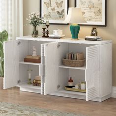 a white bookcase with two open doors