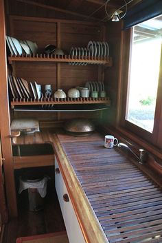 the kitchen is clean and ready to be used for cooking or baking, as well as dishes