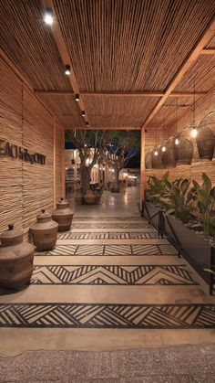 an indoor area with potted plants and lights