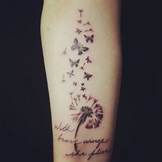 a woman's leg with a dandelion and butterflies tattoo on the side