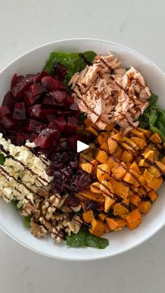 a white bowl filled with different types of food