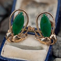 These beautiful vintage earrings feature a floral design and each earring is prong set with one (1) marquise, jadeite cabochon. The earrings measure 20.3mm long by 14.6mm wide, finished with a threaded, non-pierced back. Brand Presentation, November Birthstone, One 1, Floral Earrings, 1960s Vintage, High Quality Jewelry, Estate Jewelry, Vintage Earrings, Prong Setting