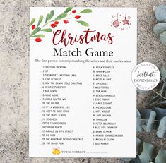 the christmas match game is next to some succulents