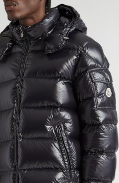 This instantly recognizable down jacket embodies Moncler's DNA with its glossy lacquered-nylon construction, channel-quilting and snap-flap sleeve pocket. A removable hood lets you adjust the level of warmth in changing conditions. Two-way front-zip closure Stand collar; removable hood Adjustable snap cuffs Front zip pockets; sleeve snap-flap pocket Lined, with down fill 100% polyamide Machine wash, line dry Imported Designer Clothing Moncler Maya, Luxury Outerwear, Down Puffer Jacket, Ski Fashion, Navy Fashion, Shell Jacket, Detachable Hood, Padded Jacket, Black Label