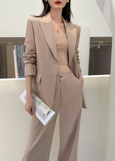 Elevate your style with our Gillian One Button Blazer Wide Leg Pantsuit Set. Crafted in luxurious khaki fabric and featuring a single-breasted blazer and wide leg pants, this set exudes sophistication and elegance. Perfect for any occasion, it's a must-have for those who demand the finest in fashion. Notched lapels Long sleeve Single-breasted closure Wide leg pants Polyester,Spandex Item #241175 Women's blazer & wide-leg pants set SIZE INFO XS=US2=UK6=EU32 S=US4-6=UK8-10=EU34-36 M=US8-10=UK12-14 Blazer And Wide Leg Pants, One Button Blazer, Breasted Blazer, Blazer Buttons, Height And Weight, In Fashion, Single Breasted, Polyester Spandex, Leg Pants