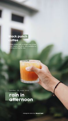 a person holding a drink in their hand with the words black punch coffee on it