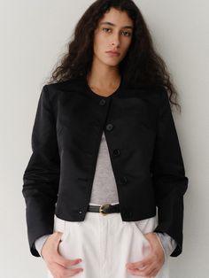 Minimal mood jacket that made of 100% re-nylon material. Featuring the simple rounded neckline, curvy seam lines at side seam, and minimal silhouette. The buttons that have same color as the jacket are also accentuated. Style with simple t-shirts and trousers to create minimal and basic outfit. - Clean rounded neckline and long sleeves- Five-button closure that has same color with the jacket- Curvy seam lines at side seam- Standard silhouette and short length Sleek Spring Outerwear With Button Closure, Sleek Spring Outerwear With Buttons, Simple Tshirt, Rounded Neckline, Basic Outfits, Casual Coat, Casual Jacket, Jackets & Coats, Trousers