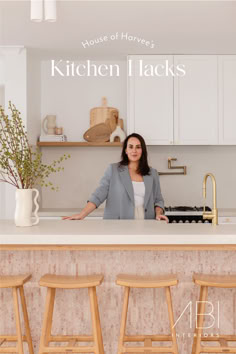 a woman standing in front of a kitchen counter