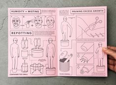 a hand holding up a pink book with instructions on how to use scissors and other things