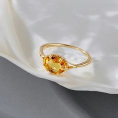 💍 Step into the timeless allure of our Vintage Bijou Wedding Engagement Ring for Women, featuring a mesmerizing Natural Citrine gemstone set in 925 Sterling Silver 18K Gold Plated  with a lavish Gold Plated finish. This stunning piece of jewelry is more than a ring; it's an expression of elegance and sophistication for your most cherished moments. 💫✨ 🌟 Main Stone: Adorned with a radiant Natural Citrine gemstone, this vintage-inspired ring captures the essence of warmth and joy. The sun-kissed Elegant Topaz Promise Ring With Diamond Cut, Elegant Diamond Cut Topaz Promise Ring, Elegant Promise Ring With Diamond Cut Topaz, Fine Citrine Jewelry For Promise, Formal Citrine Diamond Ring With Prong Setting, Exquisite Topaz Ring With Prong Setting, Elegant Topaz Ring With Diamond Cut For Promise, Elegant Yellow Oval Sapphire Ring, Elegant Yellow Open Ring