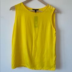 Banana Republic Yellow Sleeveless Blouse Xs 100% Rayon Button Detail On Left Shoulder. Nwt Length 23” Chest 17” Hemline Width 18” Sleeveless Summer Tops With Buttons, Summer Tank Tops With Buttons, Buttoned Tank Tops For Summer, Summer Workwear Vest Tops, Summer Workwear Tank Vest, Buttoned Sleeveless Blouse Tank Top For Summer, Buttoned Sleeveless Tank Top For Summer, Summer Sleeveless Blouse With Buttons, Sleeveless Blouse With Buttons For Summer